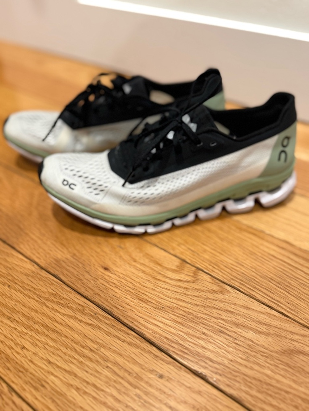 On Running Women's Cloudboom Helion Running Sneakers.